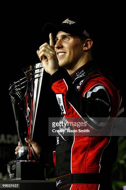 Denny Hamlin, driver of the Z-Line Designs / Operations Helmet Toyota, celebrates in victory lane after he won the NASCAR Nationwide series Royal...