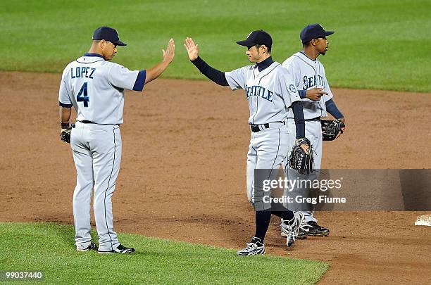 Ichiro Suzuki of the Seattle Mariners celebrates with Jose Lopez after a 5-1 victory against the Baltimore Orioles at Camden Yards on May 11, 2010 in...