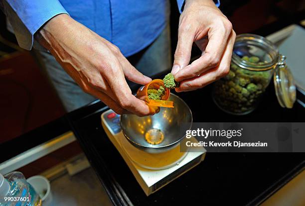 Tim Blakeley, manager of Sunset Junction medical marijuana dispensary, fills a marijuana prescription on May 11, 2010 in Los Angeles, California. The...