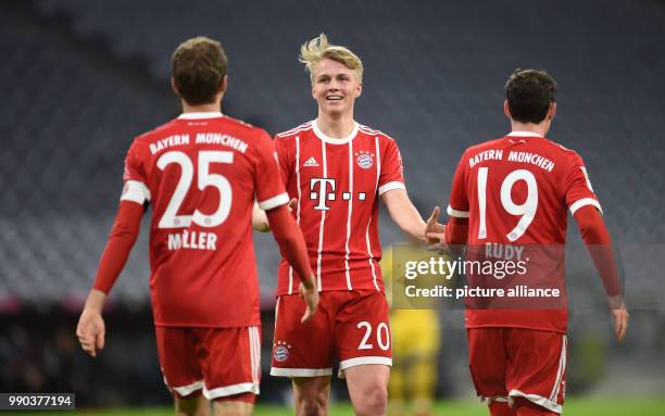 Bayern Munich's Felix Goetze celebrating a goal with Thomas Mueller and Sebastian Rudy during the Bayern Munich vs Sonnenhof Grossaspach soccer...