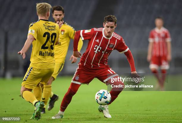 Bayern Munich's Sebastian Rudy and Grossaspach's Jannes Hoffmann vying for the ball during the Bayern Munich vs Sonnenhof Grossaspach soccer friendly...