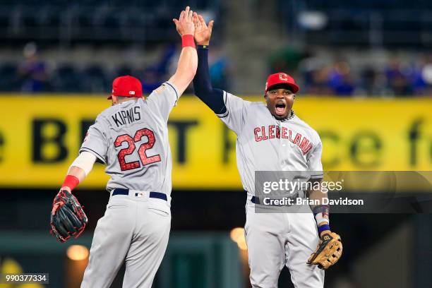 Jason Kipnis and Rajai Davis of the Cleveland Indians celebrate their win over the Kansas City Royals after the game at Kauffman Stadium on July 2,...