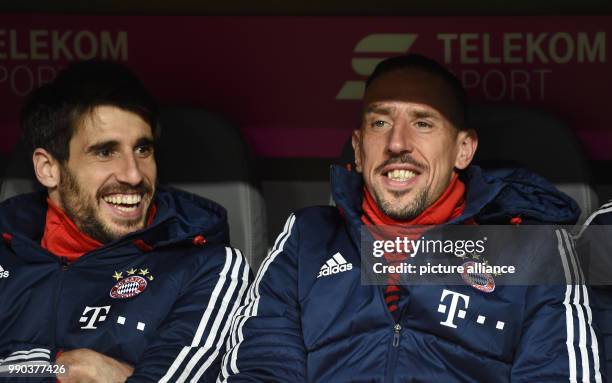 Bayern Munich's Franck Ribery and Javier Martinez sitting on the bench during the Bayern Munich vs Sonnenhof Grossaspach soccer friendly match in the...
