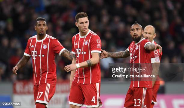 Bayern Munich's Jerome Boateng , Niklas Suele and Arturo Vidal speaking with each other during the Bayern Munich vs Sonnenhof Grossaspach soccer...