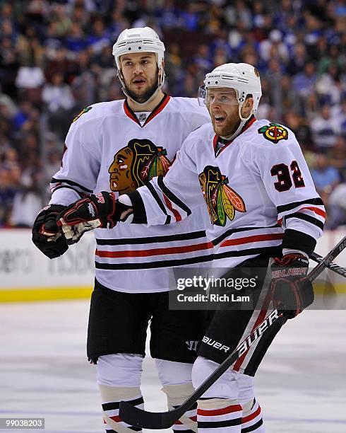 Kris Versteeg of the Chicago Blackhawks celebrates with teammate Brent Seabrook after scoring against the Vancouver Canucks during the second period...