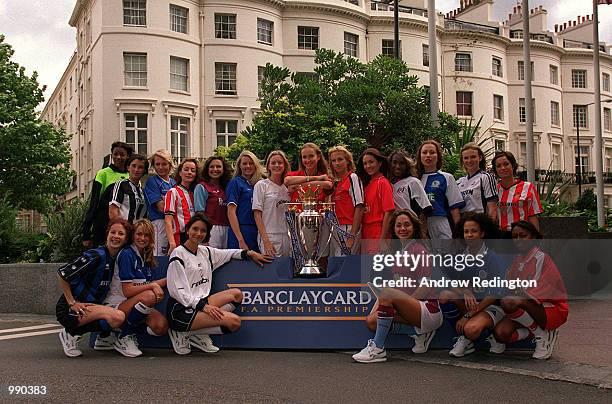 Models dressed in the strips of all 20 Premiership clubs with the new FA Barclaycard Premiership Trophy at the Royal Lancaster Hotel, London....