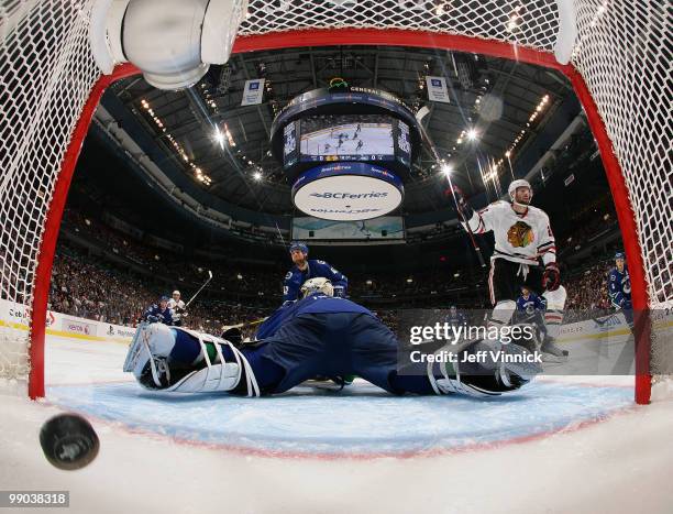 Troy Brouwer of the Chicago Blackhawks celebrates after scoring on goalie Roberto Luongo of the Vancouver Canucks in Game 6 of the Western Conference...