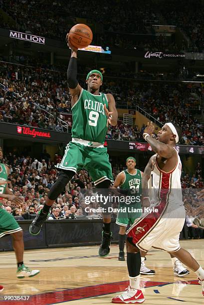 Rajon Rondo of the Boston Celtics tosses up the shot against Daniel Gibson of the Cleveland Cavaliers in Game Five of the Eastern Conference...