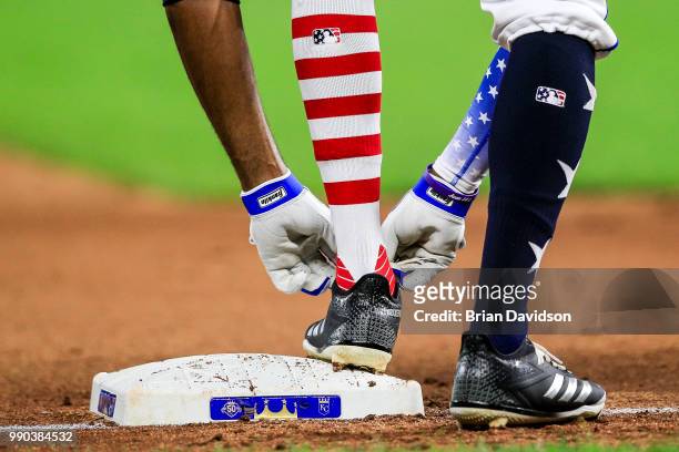 Rosell Herrera of the Kansas City Royals adjust his shoes during the sixth inning against the Cleveland Indians at Kauffman Stadium on July 2, 2018...