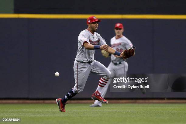 Fly ball drops past Eddie Rosario of the Minnesota Twins in the fifth inning against the Milwaukee Brewers at Miller Park on July 2, 2018 in...