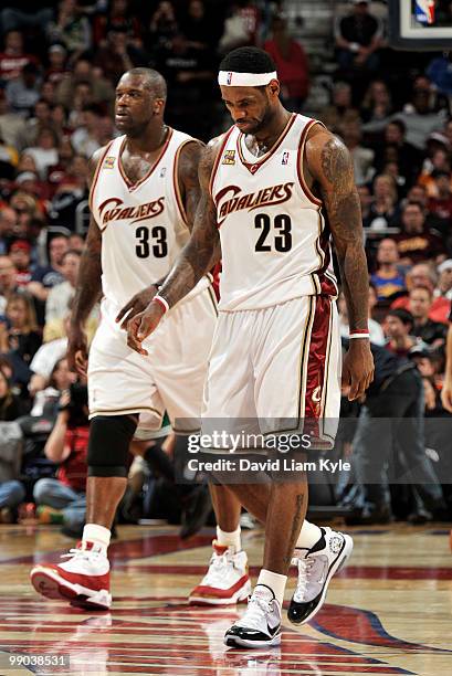 LeBron James and Shaquille O'Neal of the Cleveland Cavaliers walk to the sidelines during a timeout late in the fourth quarter of their loss to the...