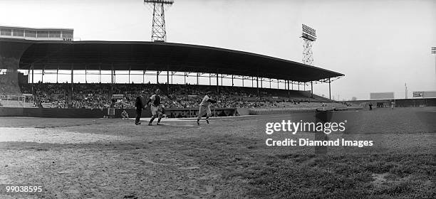 General panoramic view of the action as Alvin Dark of the New York Giants runs towards firstbase during a Spring Training game on April 12, 1956...