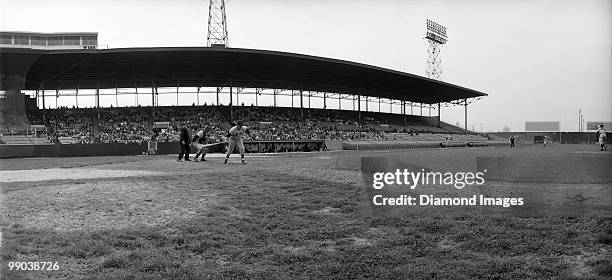 General panoramic view of the action as outfielder Don Mueller of the New York Giants runs towards firstbase during a Spring Training game on April...