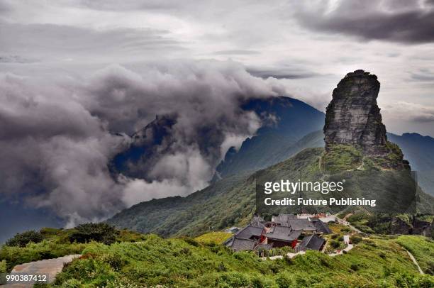 View of the iconic rock of Fanjingshan Mountain in Jiangkou county in southwest China's Guizhou province Tuesday, Sept. 11, 2012. Fanjingshan,...