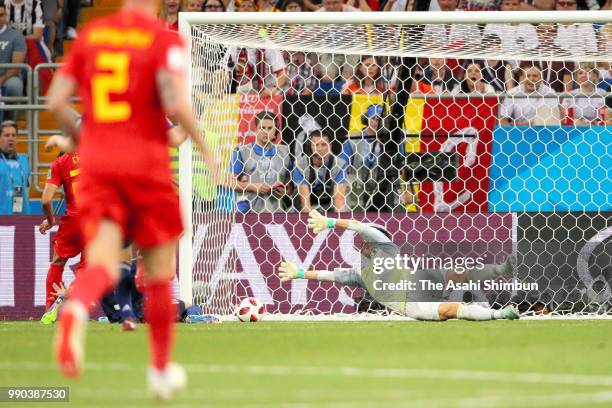 Eiji Kawashima of Japan dives in vain as Nacer Chadli of Belgium scores his side's third goal during the 2018 FIFA World Cup Russia Round of 16 match...