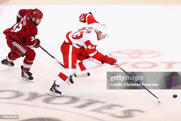 Darren Helm of the Detroit Red Wings skates with the puck past the Phoenix Coyotes in Game Seven of the Western Conference Quarterfinals during the...