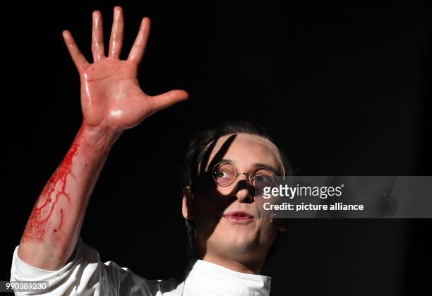 The actor Mehmet Atesci stands on stage during the picture rehearsal of the play 'Glaube Liebe Hoffnung' at the Maxim Gorki Theatre in Berlin,...