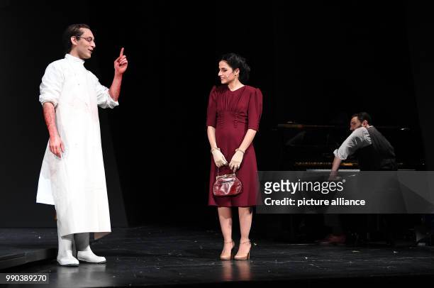 The actors Mehmet Atesci , Sesede Terziyan and Daniel Kahn stand on stage during the picture rehearsal of the play 'Glaube Liebe Hoffnung' at the...