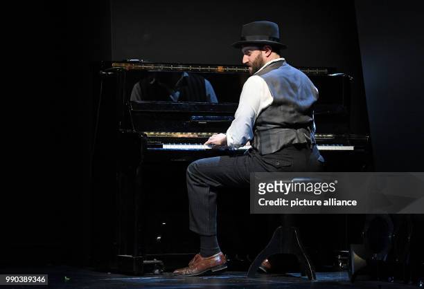 The actor Daniel Kahn stands on stage during the picture rehearsal of the play 'Glaube Liebe Hoffnung' at the Maxim Gorki Theatre in Berlin, Germany,...