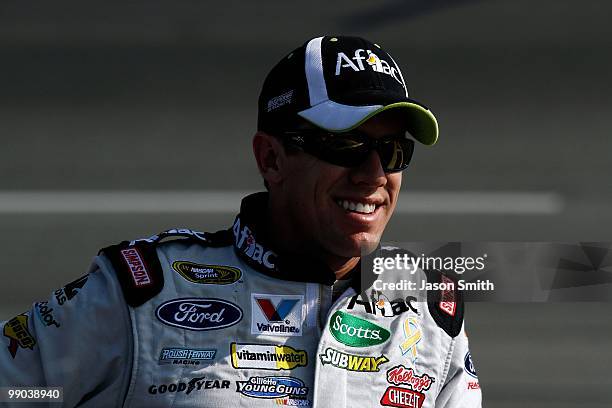 Carl Edwards, driver of the Aflac Ford, looks on during qualifying for the NASCAR Sprint Cup Series SHOWTIME Southern 500 at Darlington Raceway on...