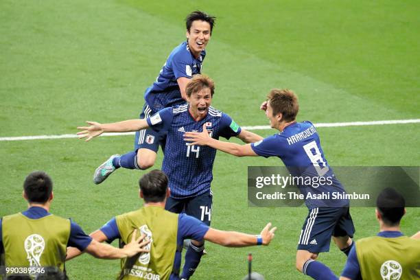 Takashi Inui of Japan celebrates scoring his side's second goal with his team mates during the 2018 FIFA World Cup Russia Round of 16 match between...