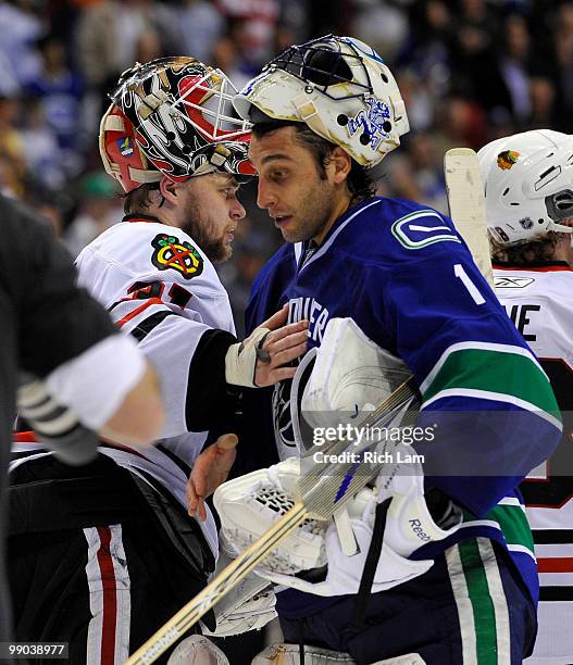 Goalie Roberto Luongo of the Vancouver Canucks and goalie Antti Niemi of the Chicago Blackhawks shake hands after the Blackhawks defeated the Canucks...