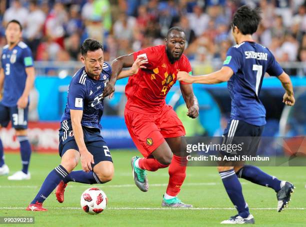 Romelu Lukaku of Belgium controls the ball under pressure of Maya Yoshida and Gaku Shibsaki of Japan during the 2018 FIFA World Cup Russia Round of...
