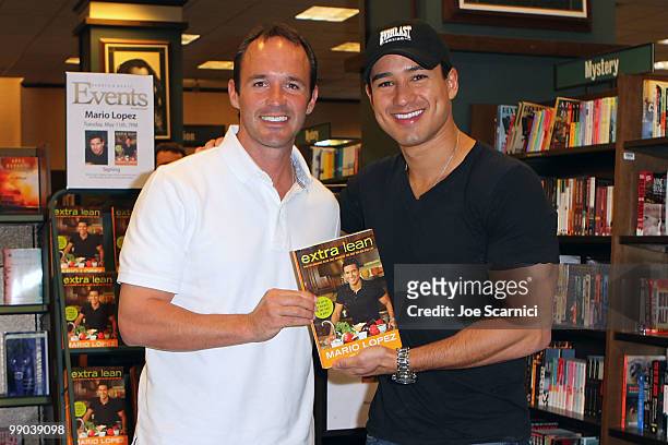 Co-author Jimmy Pena and Mario Lopez pose with their new book "Extra Lean" at Barnes & Noble on May 11, 2010 in Huntington Beach, California.