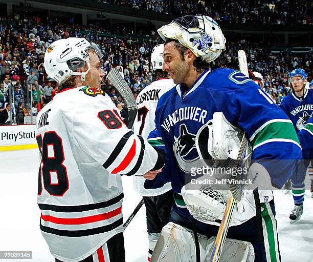 Roberto Luongo of the Vancouver Canucks shakes hands with Patrick Kane of the Chicago Blackhawks in Game 6 of the Western Conference Semifinals...