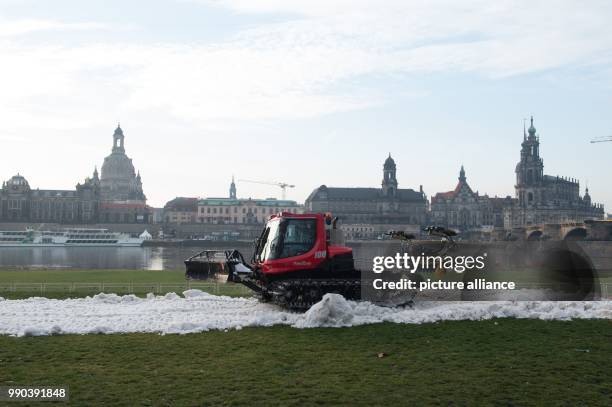 PistenBully prepares a route with artificial snow along the river Elbe in Dresden, Germany, 11 January 2018. The upcoming FIS Sprint World Cup Cross...