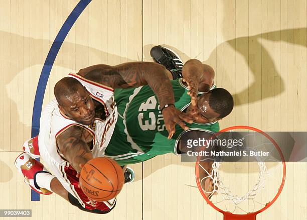 Shaquille O'Neal of the Cleveland Cavaliers shoots against Kendrick Perkins of the Boston Celtics in Game Five of the Eastern Conference Semifinals...