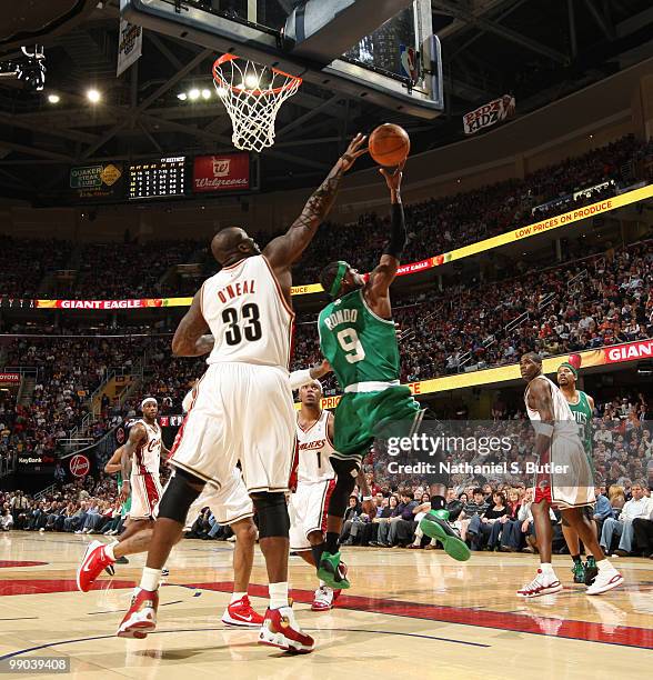Rajon Rondo of the Boston Celtics shoots against Shaquille O'Neal of the Cleveland Cavaliers in Game Five of the Eastern Conference Semifinals during...
