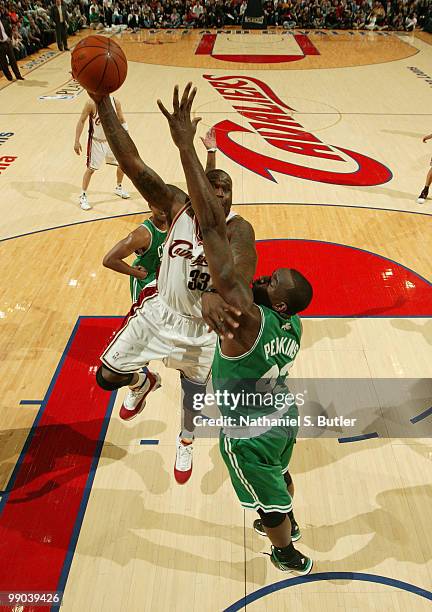 Shaquille O'Neal of the Cleveland Cavaliers shoots against Kendrick Perkins of the Boston Celtics in Game Five of the Eastern Conference Semifinals...