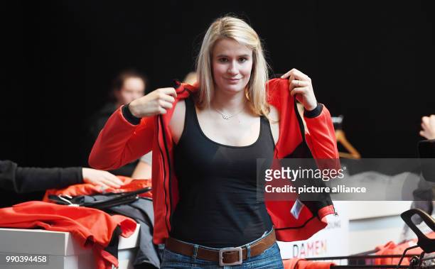 Luge athlete Natalie Geisenberger picks up her official clothes for the Winter Olympic Games Pyeonchang in Munich, Germany, 11 January 2018. Photo:...