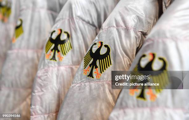 View of the official jackets for the Winter Olympic Games Pyeonchang in Munich, Germany, 11 January 2018. Photo: Tobias Hase/dpa