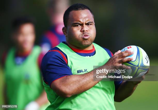 Sam Talakai of the Rebels runs with the ball during a Melbourne Rebels Super Rugby training session at Gosch's Paddock on July 3, 2018 in Melbourne,...