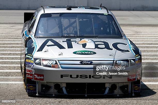 Carl Edwards, driver of the Aflac Ford, drives his car back to the garage during practice for the NASCAR Sprint Cup Series SHOWTIME Southern 500 at...