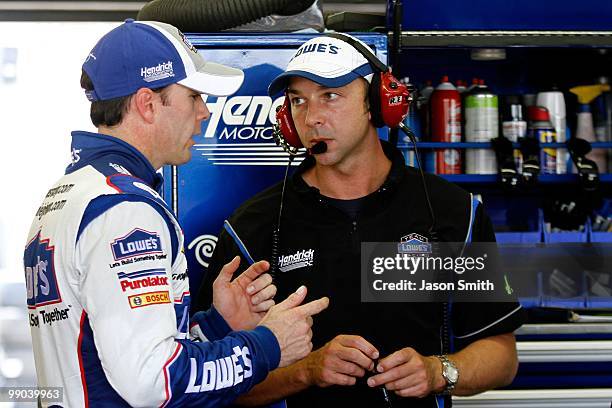 Jimmie Johnson , driver of the Lowe's Chevrolet speaks with crew chief Chad Knaus , during practice for the NASCAR Sprint Cup Series SHOWTIME...