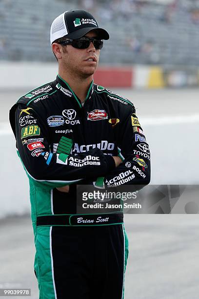 Brian Scott, driver of the AccuDoc Solutions Toyota, looks on during qualifying for the NASCAR Nationwide series Royal Purple 200 presented by...
