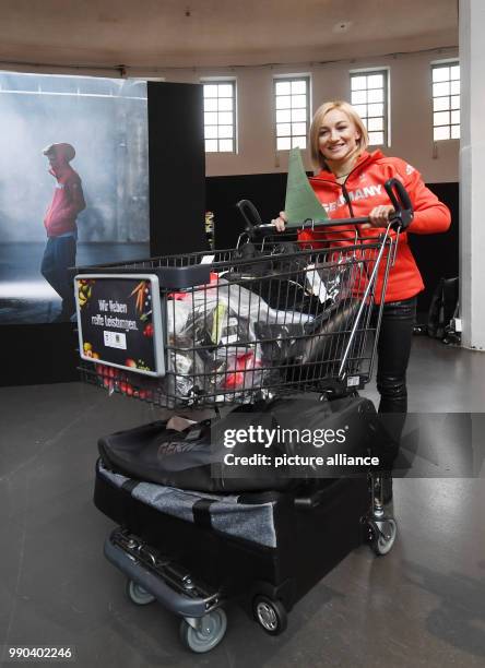 Figure skater Aljona Savchenko picks up her official outfits for the Winter Olympic Games Pyeongchang in Munich, Germany, 11 January 2018. Photo:...