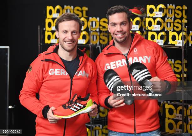 Luge athletes Tobias Wendl and Tobias Arlt pick up their official clothes for the Winter Olympic Games Pyeonchang in Munich, Germany, 11 January...