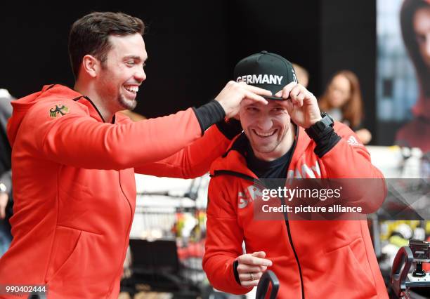 Luge athletes Tobias Wendl and Tobias Arlt pick up their official clothes for the Winter Olympic Games Pyeonchang in Munich, Germany, 11 January...