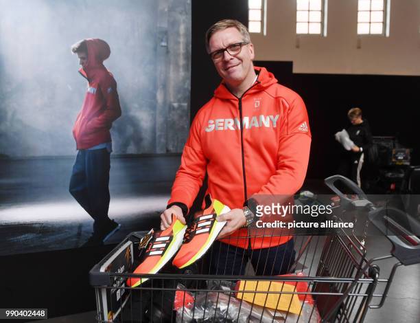 Leader of Mission Dirk Schimmelpfennig picks up his official clothes for the Winter Olympic Games Pyeonchang in Munich, Germany, 11 January 2018....