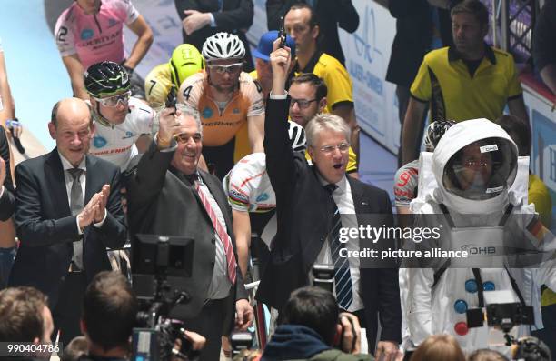 Former astronaut Thomas Reiter fires the starting shot for the 54th Six-Day Race next to OHB chairman Fritz Merkle in the ÖVB-Arena in Bremen, 11...