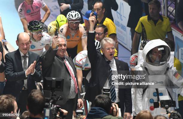 Former astronaut Thomas Reiter fires the starting shot for the 54th Six-Day Race next to OHB chairman Fritz Merkle in the ÖVB-Arena in Bremen, 11...