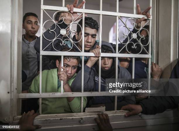 Mourners attend the funeral of 16-year old Amir Abu Musaed in the Maghazi refugee camp, central Gaza Strip, 12 January 2018. The teenager was shot...