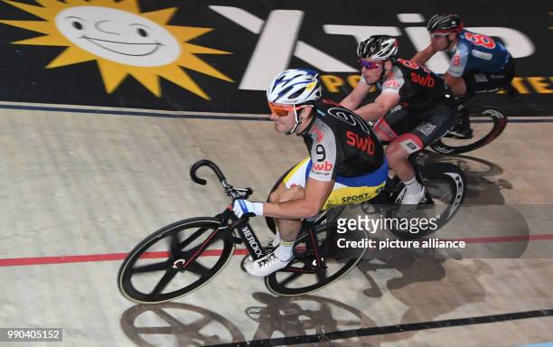 German professional cyclist Theo Reinhardt and Belgian Kenny De Ketele change during the 54th Six-Day Race in the ÖVB-Arena in Bremen, 11 January...