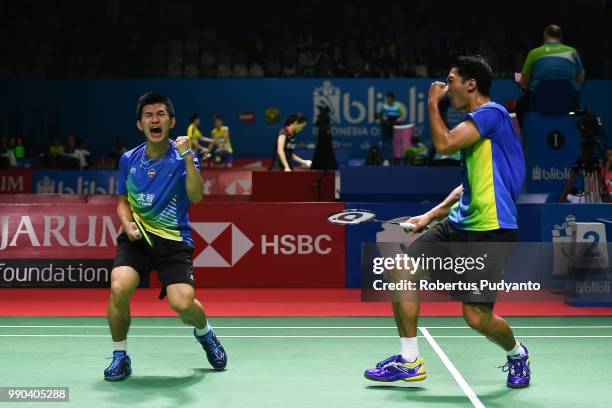 Liao Min Chun and Su Ching Heng of Chinese Taipei celebrate victory after beating Mathias Boe and Carsten Mogensen of Denmark during the Men's...