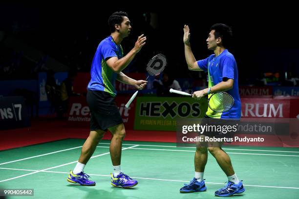 Liao Min Chun and Su Ching Heng of Chinese Taipei celebrate victory after beating Mathias Boe and Carsten Mogensen of Denmark during the Men's...
