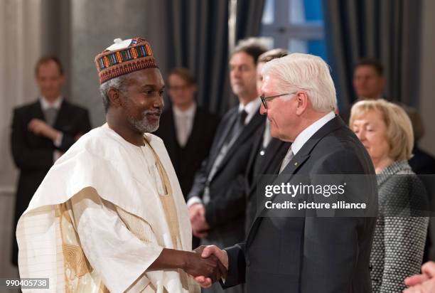 German President Frank-Walter Steinmeier greets Nigerian diplomat Yusuf Maitama Tuggar at the annual New Year's reception for the diplomatic corps in...